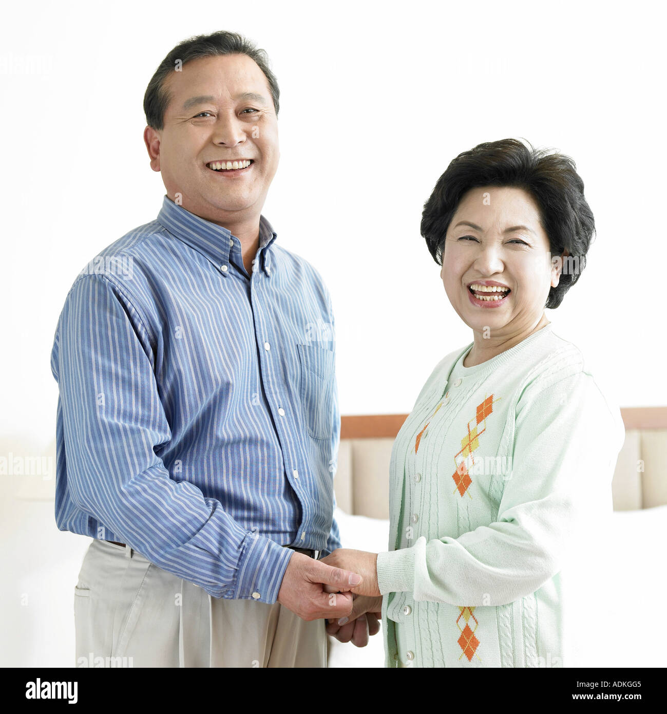an old couple holding each other s hands Stock Photo