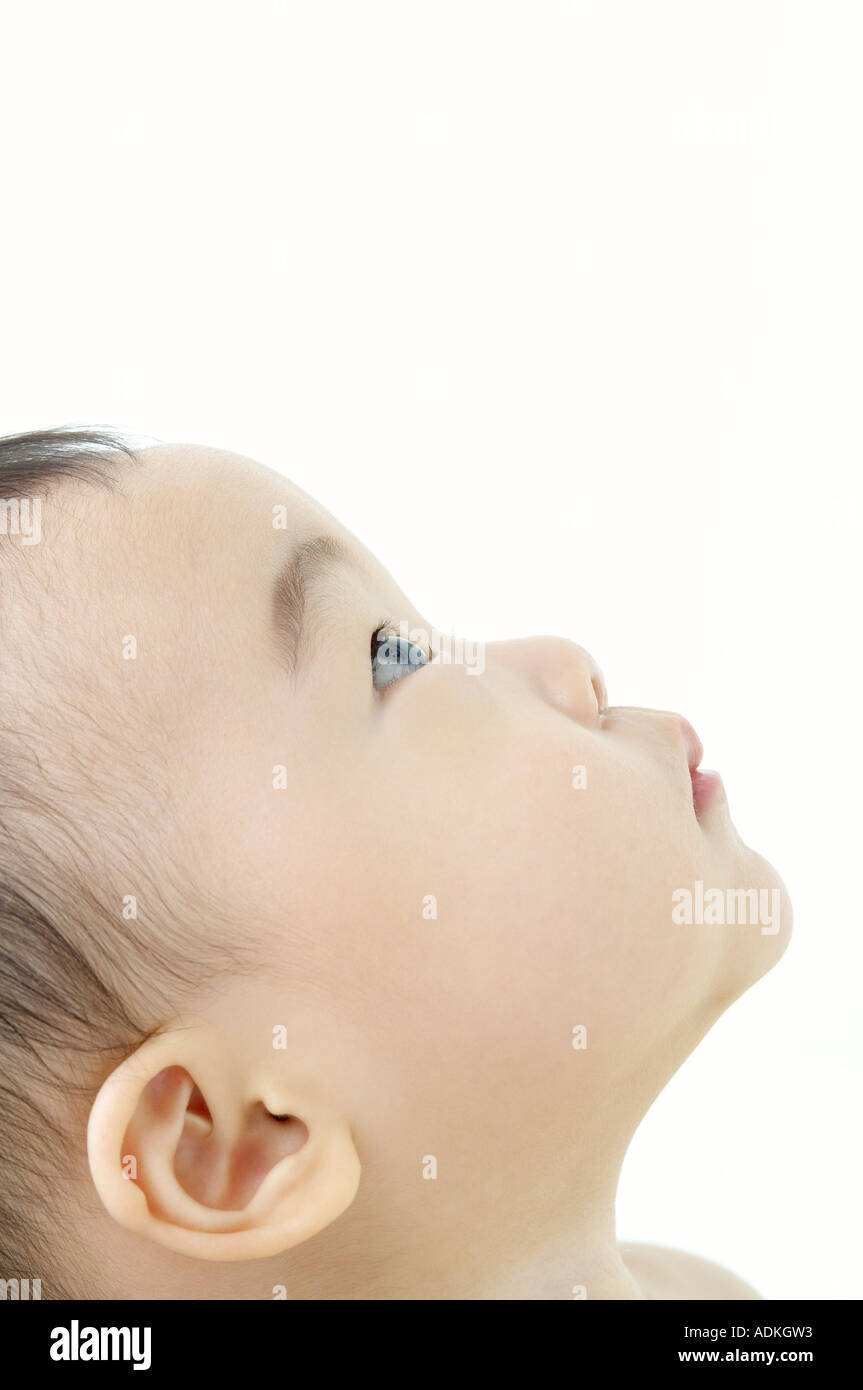 a baby looking upwards Stock Photo Alamy