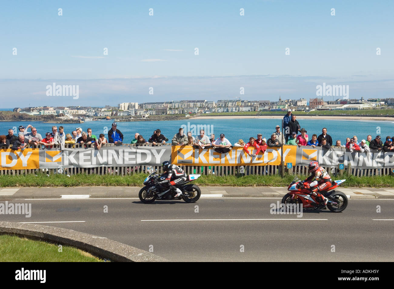 Road race contestants head for Portstewart in the 'North West 200' annual international motorcycle races. Portrush in distance. Stock Photo