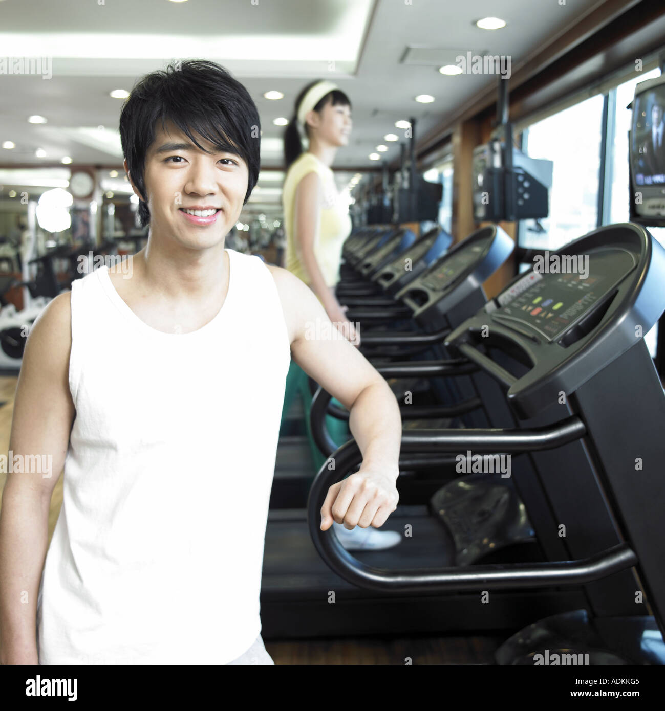 a running man on a running machine at a fitness club Stock Photo Alamy