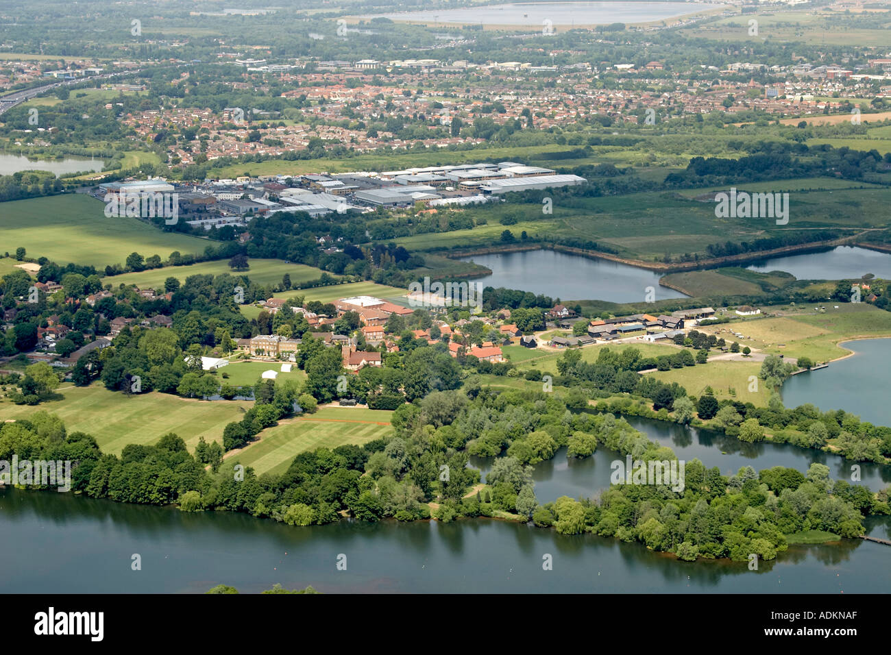 Oblique high level aerial view north to Thorpe with Torpe Infant School Tasis The American School Of England Blackhouse Farm Sky Business Centre and Egham Business Village London KT16 TW20 TW18 England 2005 Stock Photo