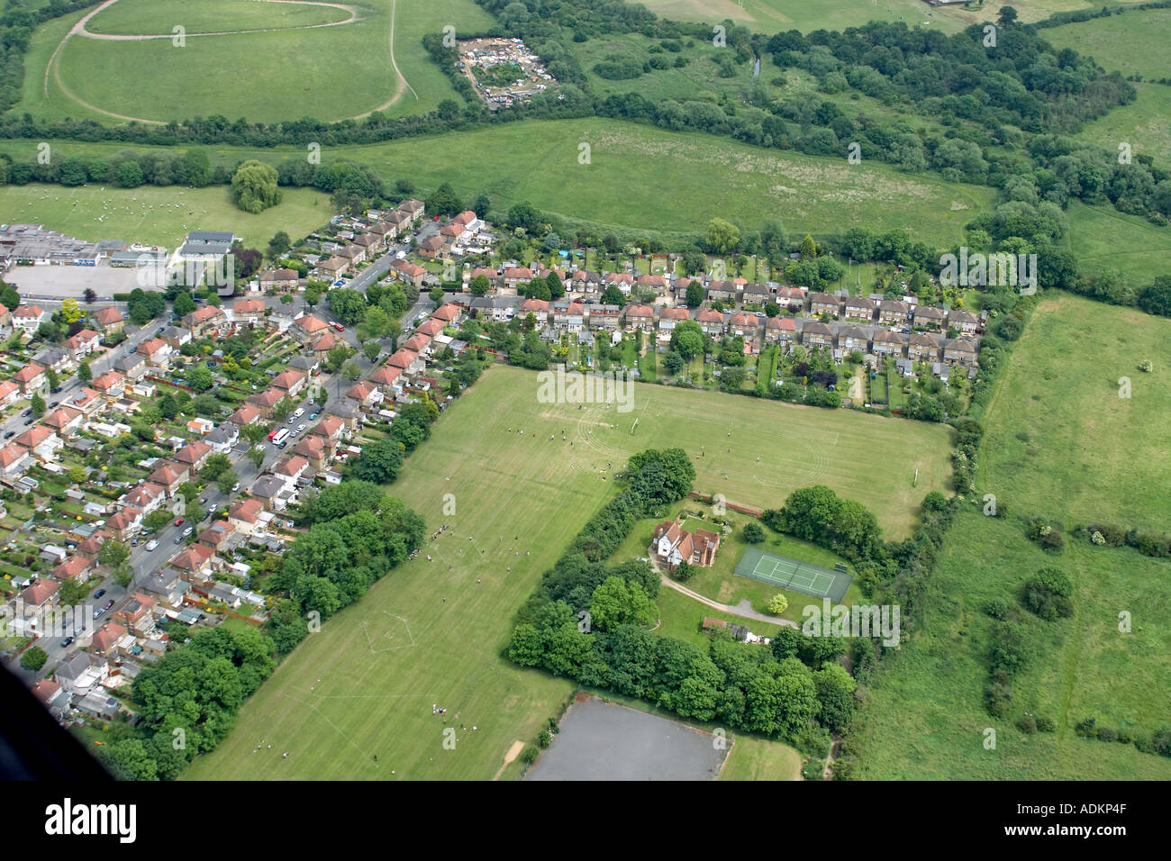 Oblique high level aerial view east of Ickenham with Ickenham Manor