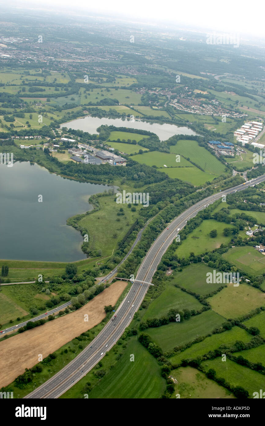 Oblique high level aerial view east of Elstree with M1 Motorway Hilfield Park Reservoir and Aldenham Country Park London WD2 WD6 HA8 England 2005 Stock Photo