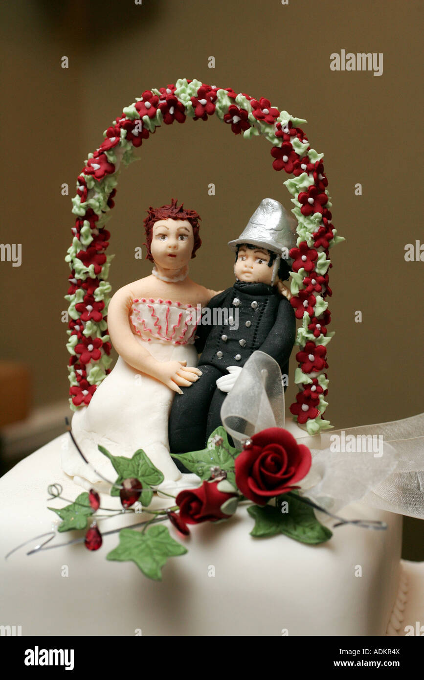 Wedding figures on top of a wedding cake Stock Photo