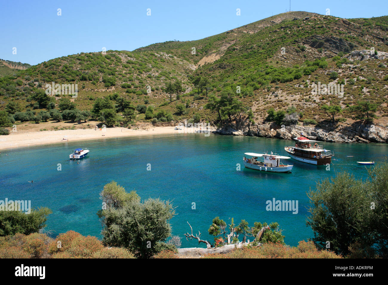 boats at an idyllic bay between Loutra and Alyki on the island of Thasos in Greece Stock Photo