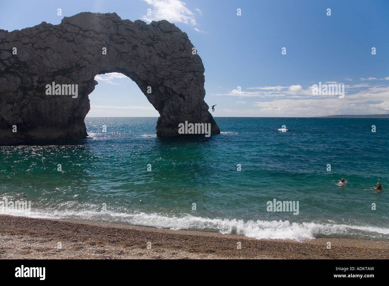 Durdle Door beach with natural limestone arch Jurassic Coast World Heritage Site on sunny summers day Dorset England UK GB Stock Photo