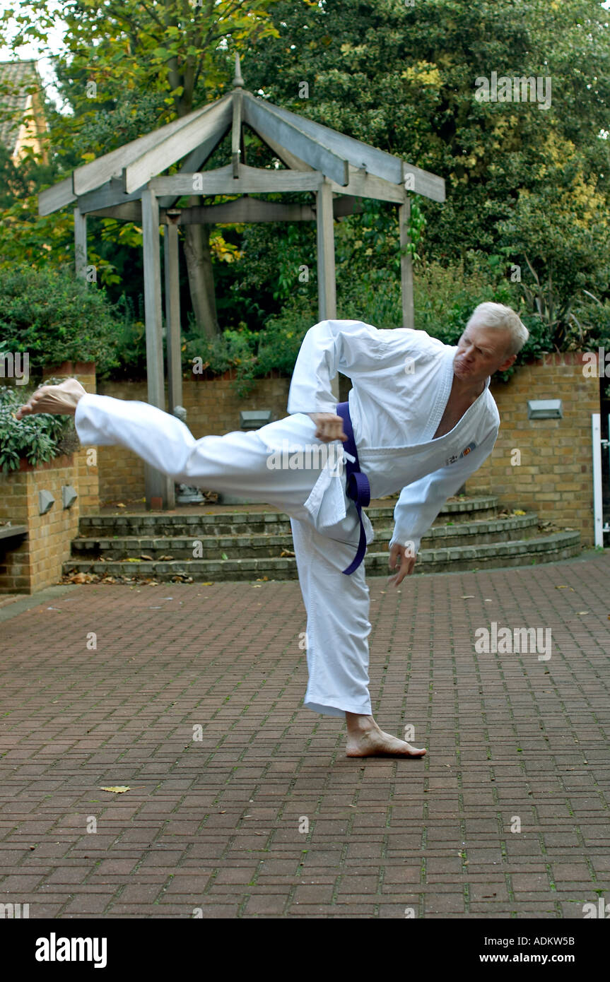 Blind man practicing karate martial arts outside Stock Photo Alamy