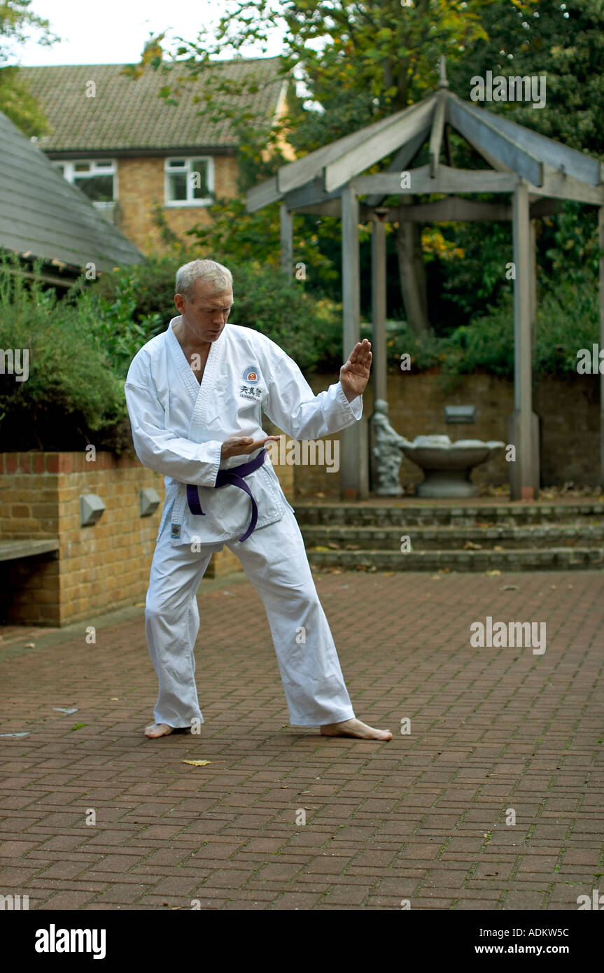 Blind man practicing karate martial arts outside Stock Photo Alamy
