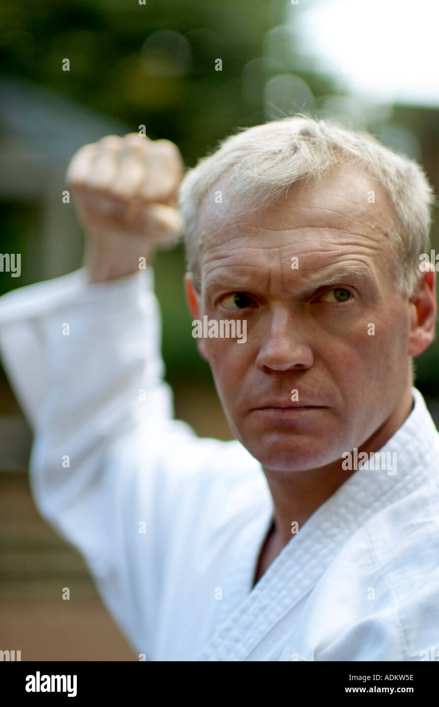 Blind man practicing karate martial arts outside Stock Photo Alamy