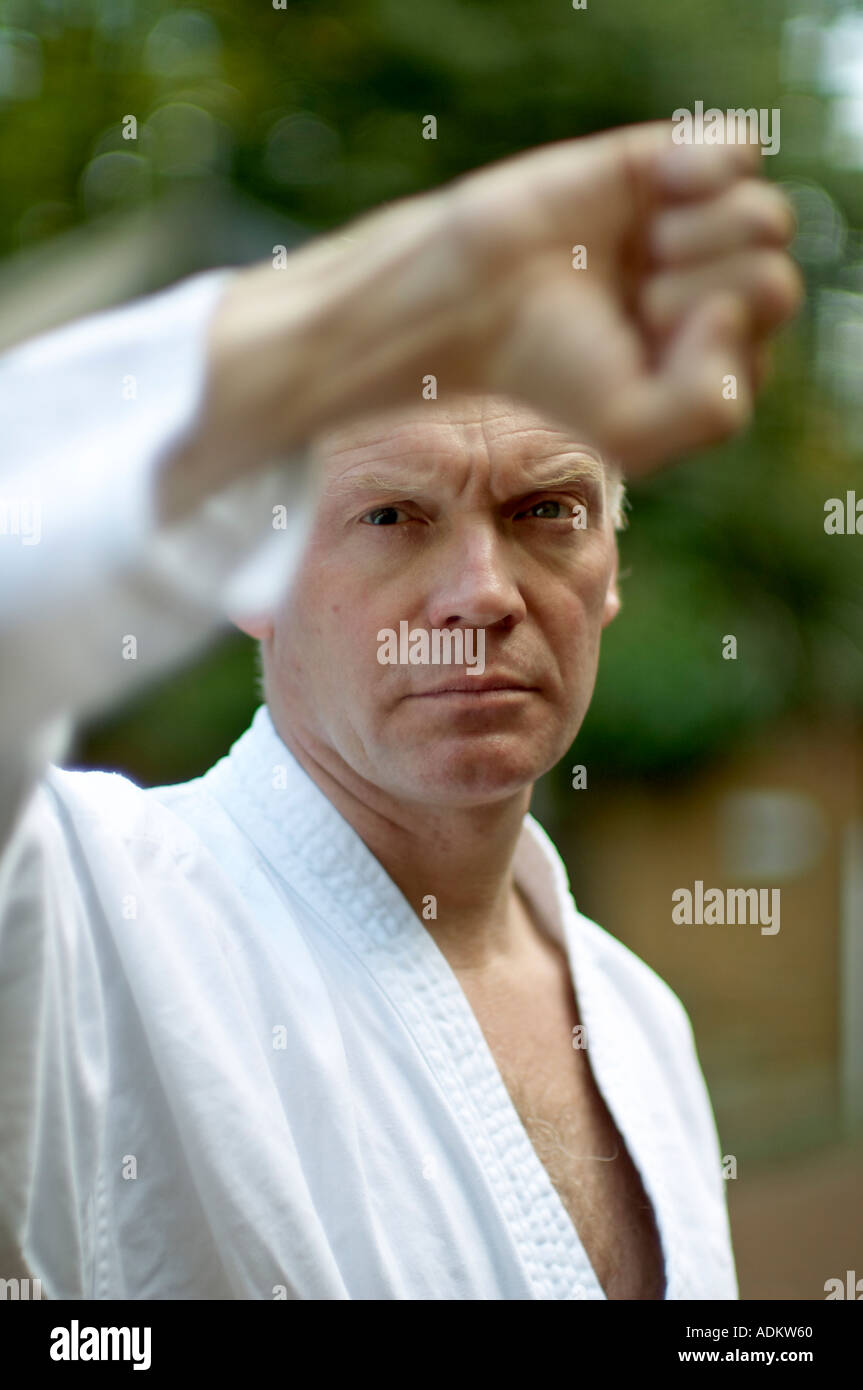Blind man practicing karate martial arts outside Stock Photo Alamy