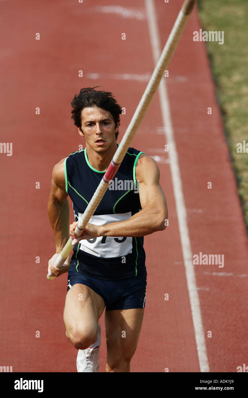 Male Pole Vaulter Sprinting Down the Track Stock Photo Alamy