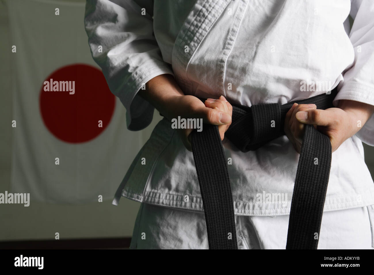 Taekwondo Fighter Tightening Belt Stock Photo