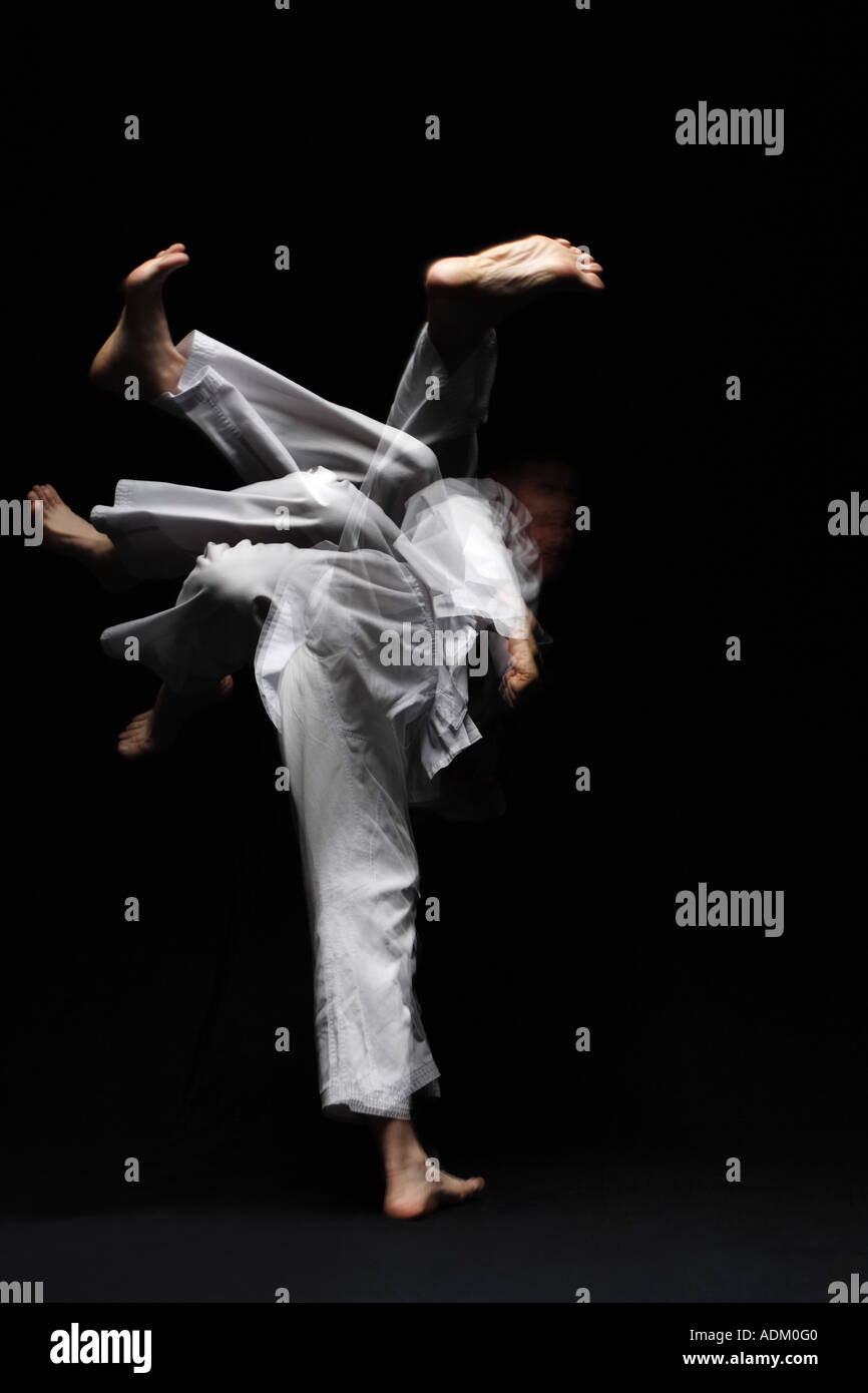 Blackbelt Making Spin Kick Stock Photo - Alamy
