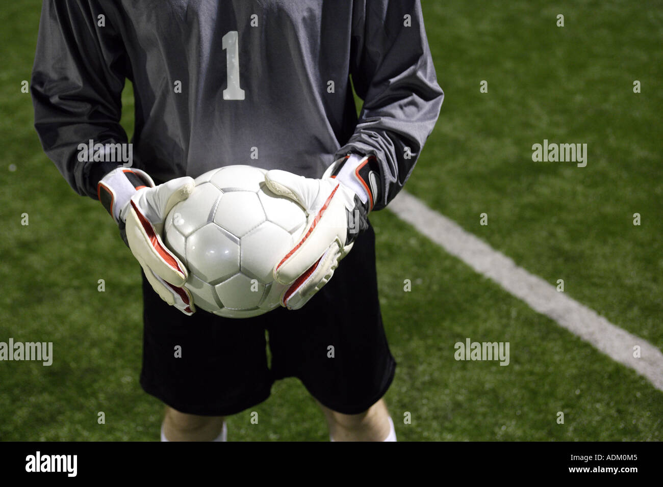 Goalkeeper Holding A Soccer Ball Stock Photo Alamy