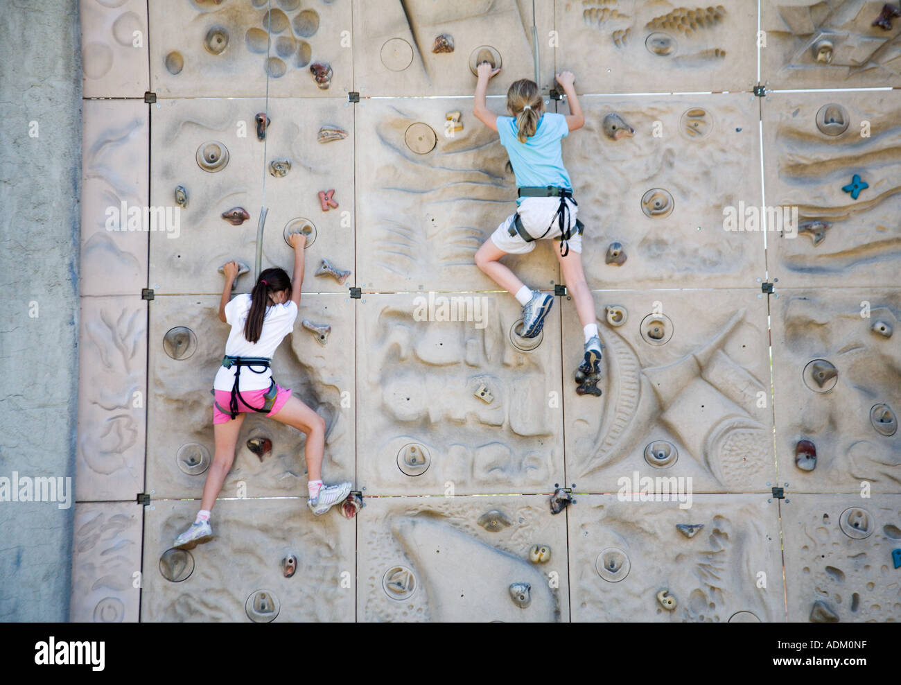 Ten Year Old Girls climbing at Six Flags Magic Mountain Valencia California United States of America Stock Photo