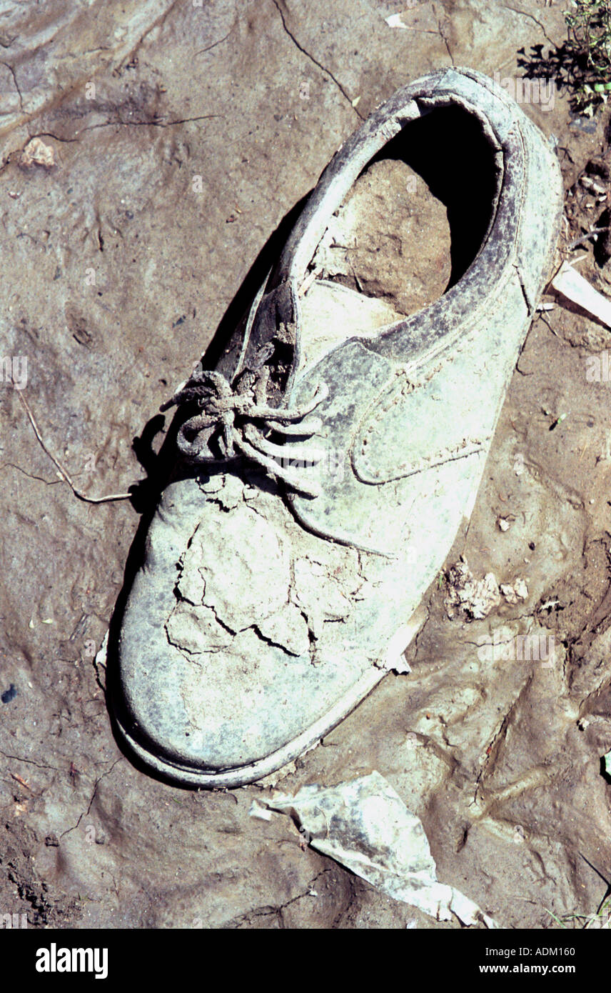 man s shoe covered in mud Stock Photo Alamy