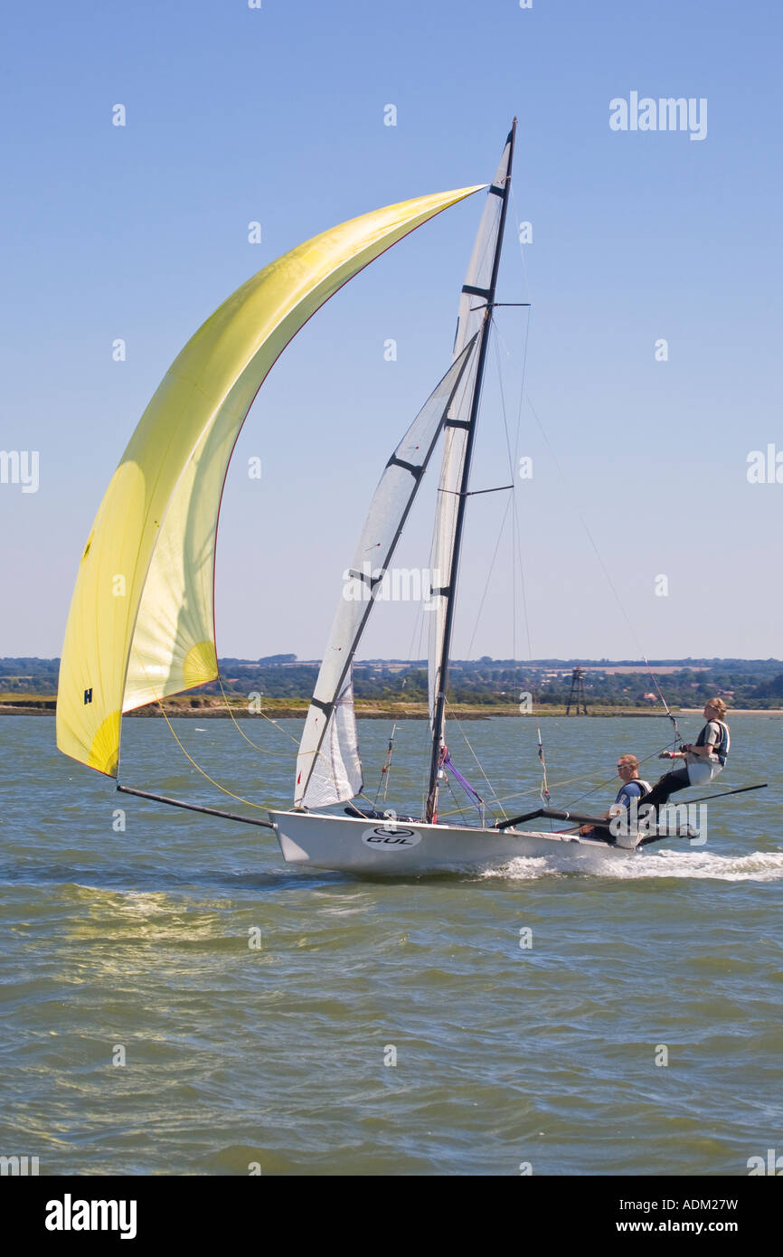A racing sailing boat on the river Medway under full sail with