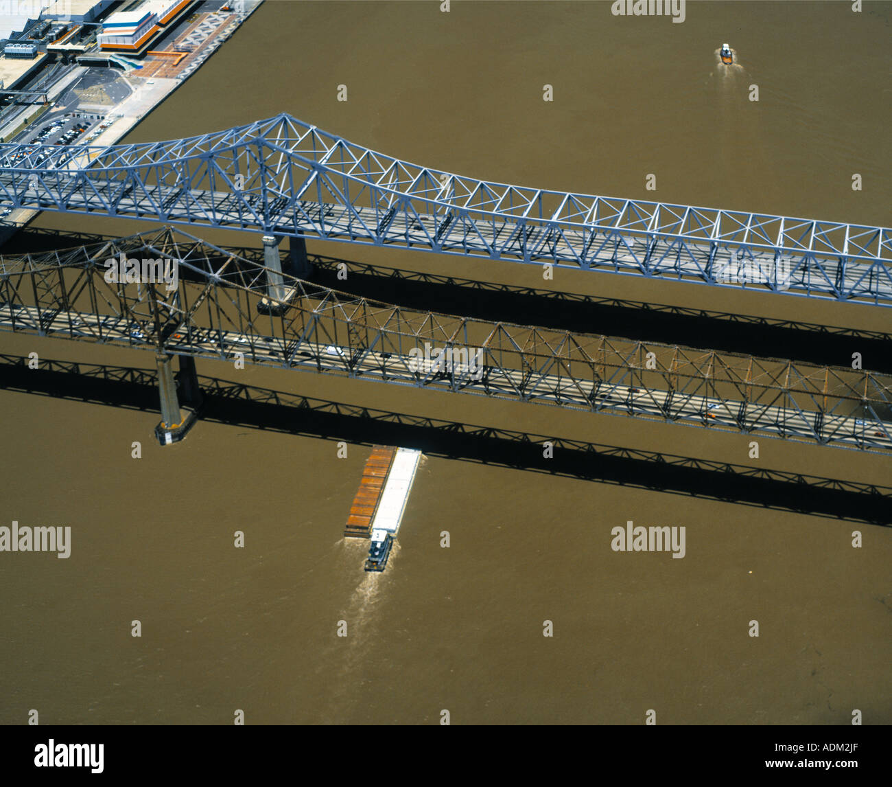 aerial above barge passing under Greater New Orleans Louisiana