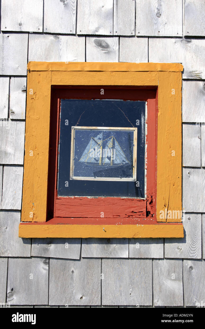 window in shed with picture of a sailboat displayed, Nova Scotia, Atlantic Canada.  Photo by Willy Matheisl Stock Photo