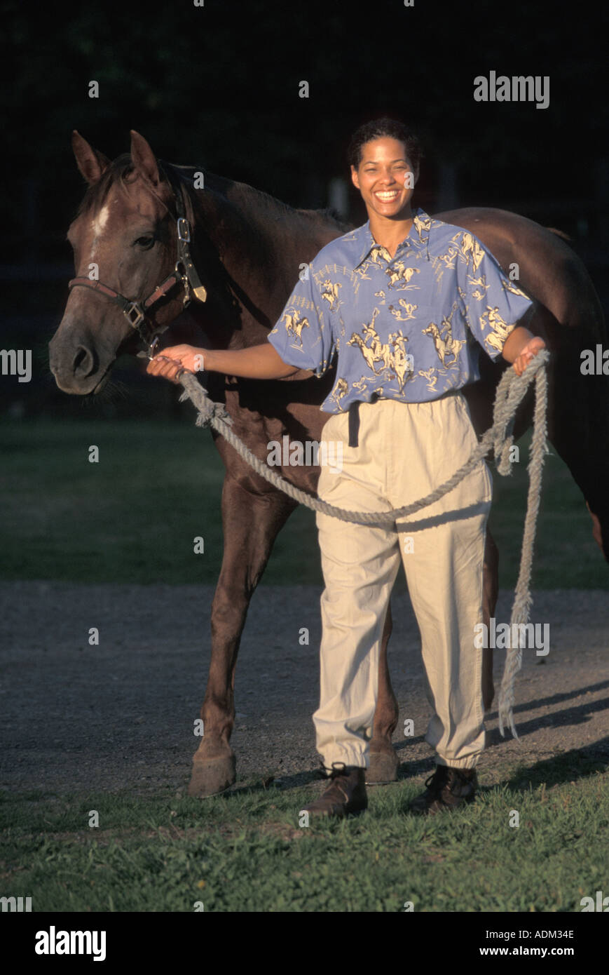 Woman smiling animal enclosure hi-res stock photography and images - Alamy