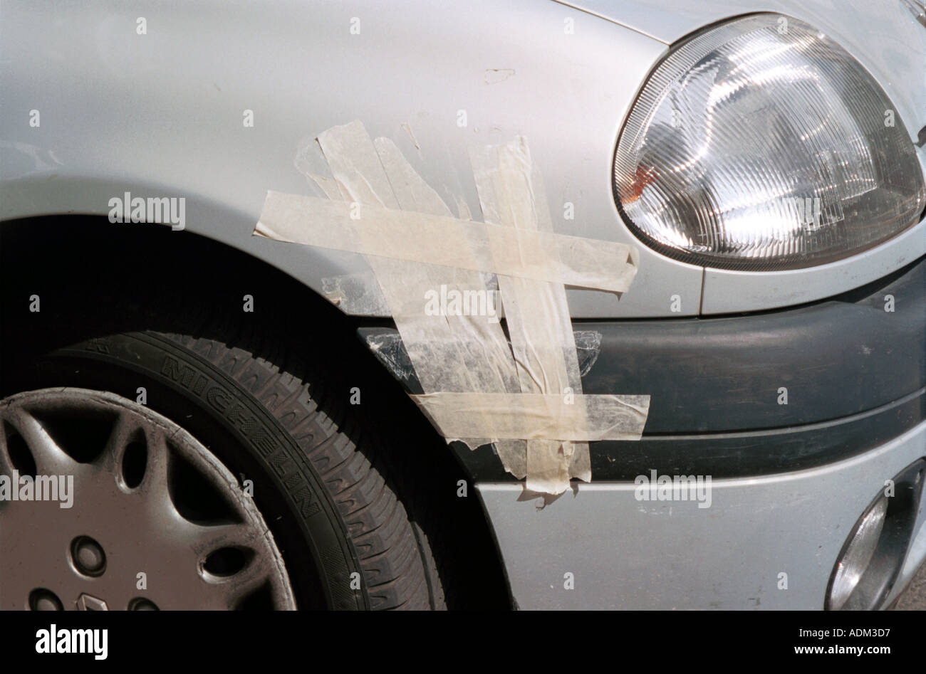masking tape used to repair car bumper dent Stock Photo - Alamy