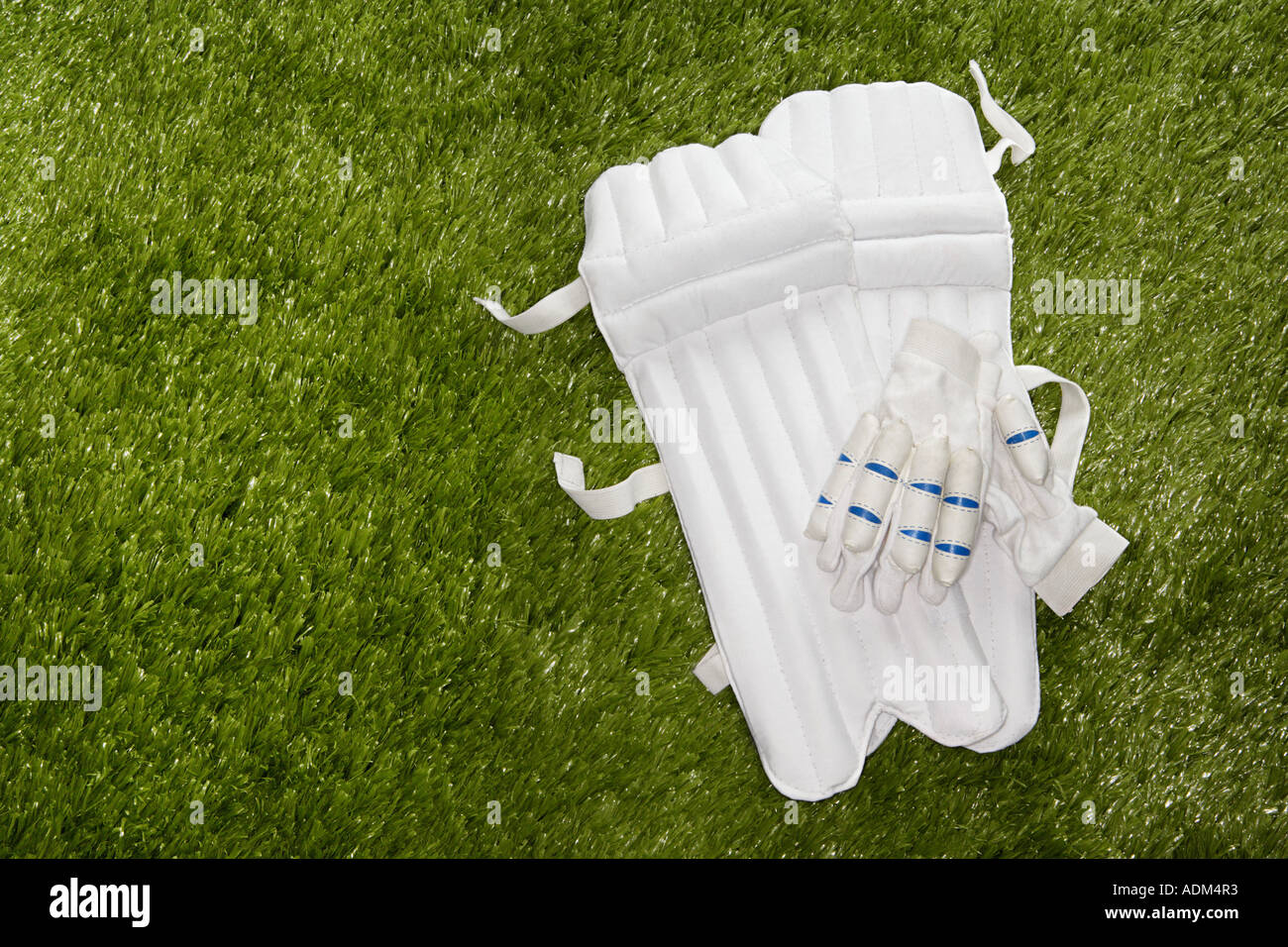 Cricket gloves and shin pads Stock Photo