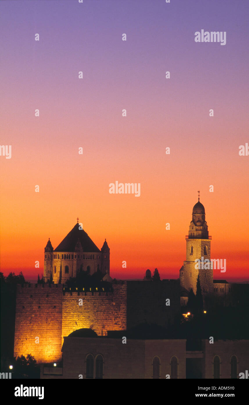 The Abbey of the Dormition stands at dawn over theWall of David near Zion Gate in the Old City, Jerusalem, Israel. Stock Photo
