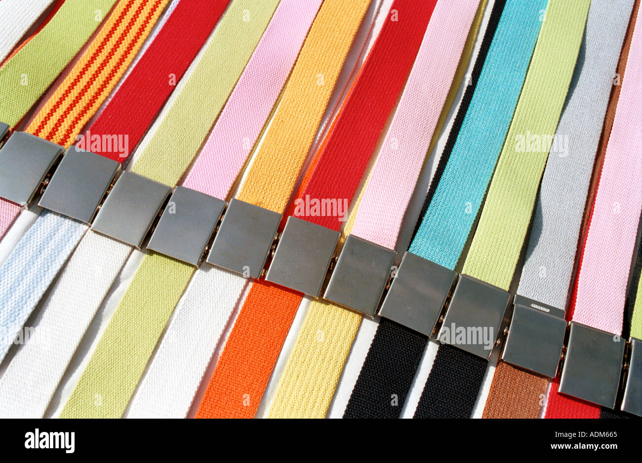 colourful canvas belts on display Stock Photo - Alamy
