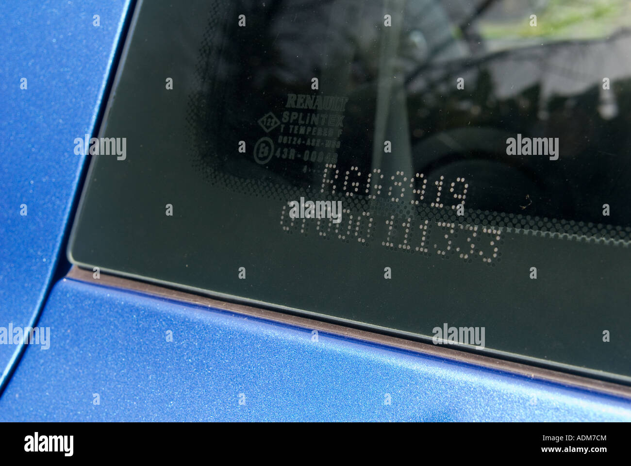 Security etching on a car window in the uk Stock Photo Alamy