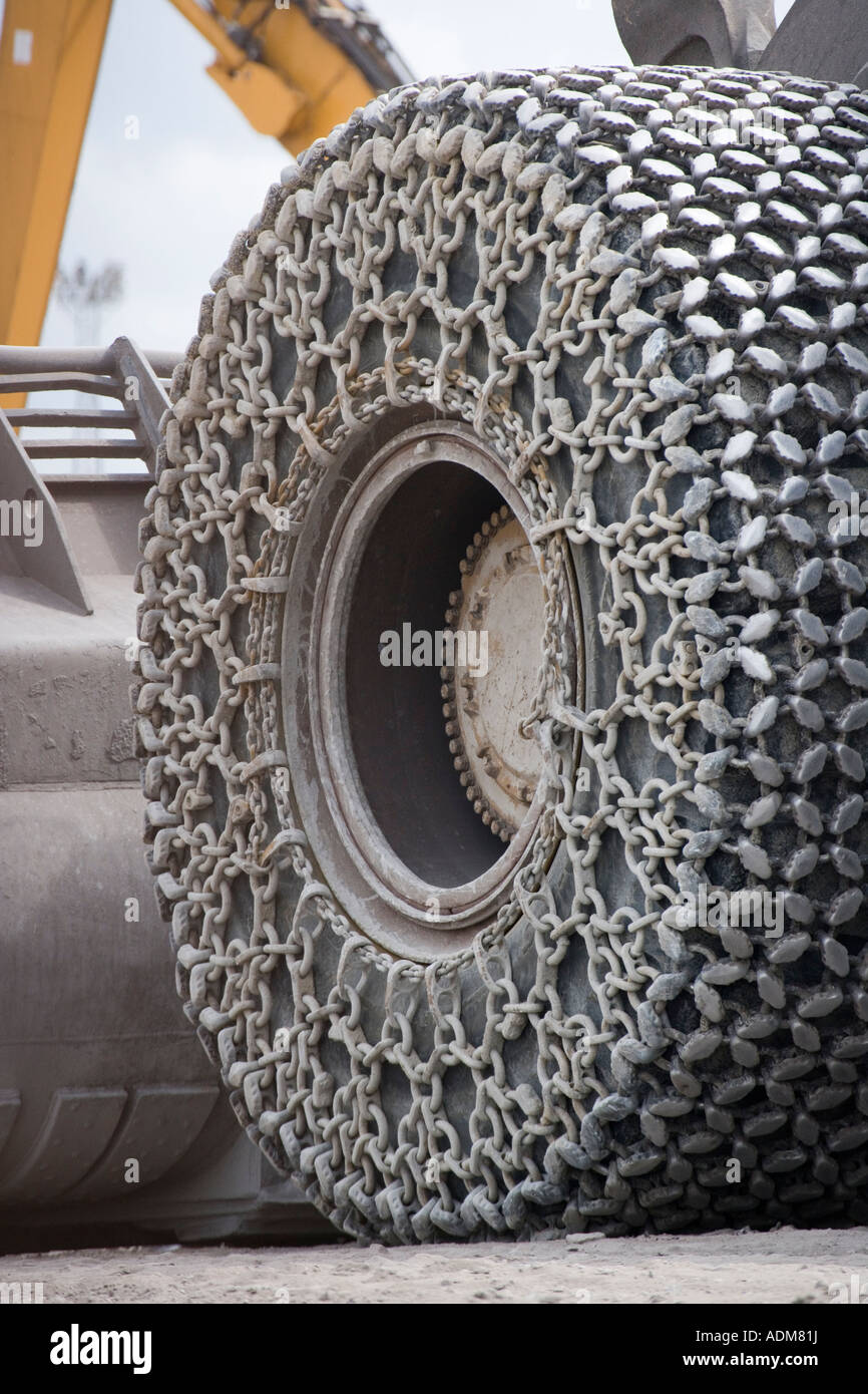A large wheel on a heavy loader tractor working at Redcar Steelworks Teesside Cleveland England UK Stock Photo