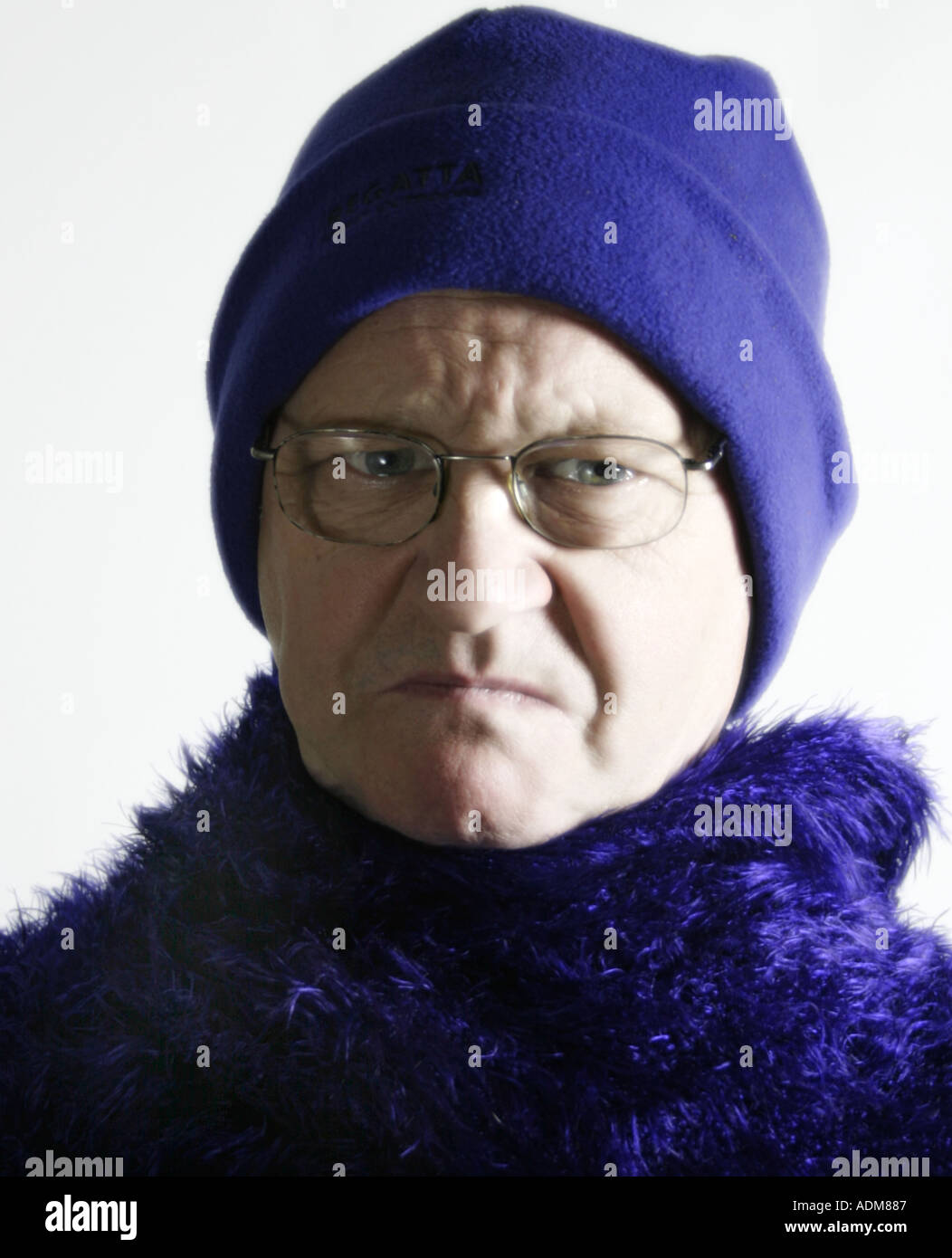 Man in his sixties wears purple Stock Photo