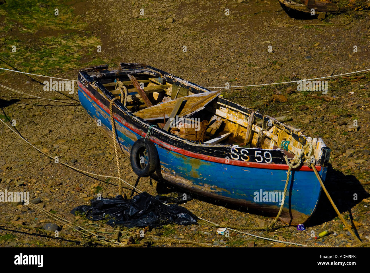 Old Derelict Wooden Fishing Boat at Low Tide Stock Photo - Alamy