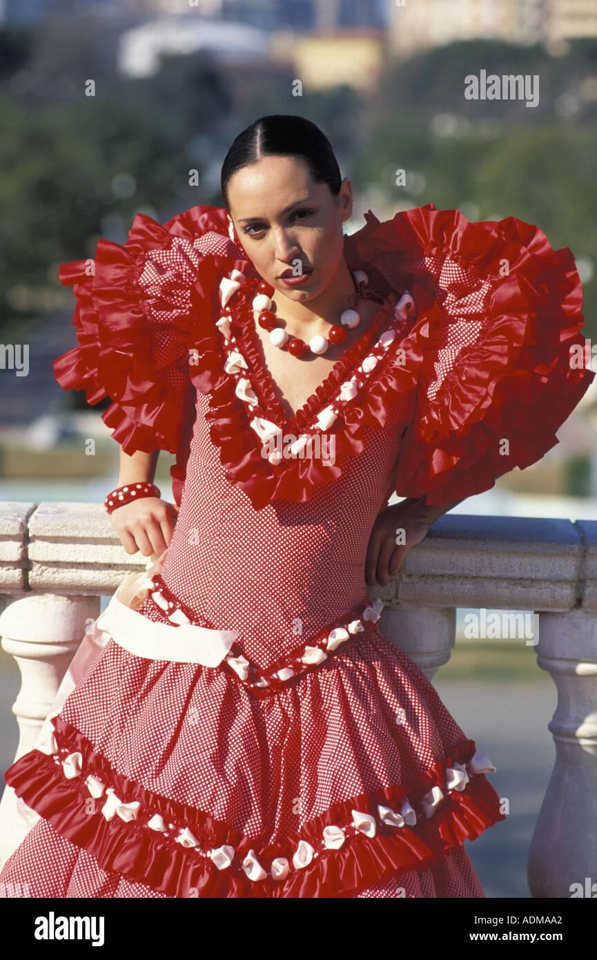 Spanish young woman dressed in sevillana traditional attire MR