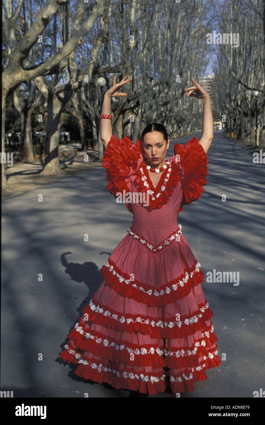 Spanish young woman dressed in sevillana traditional attire MR