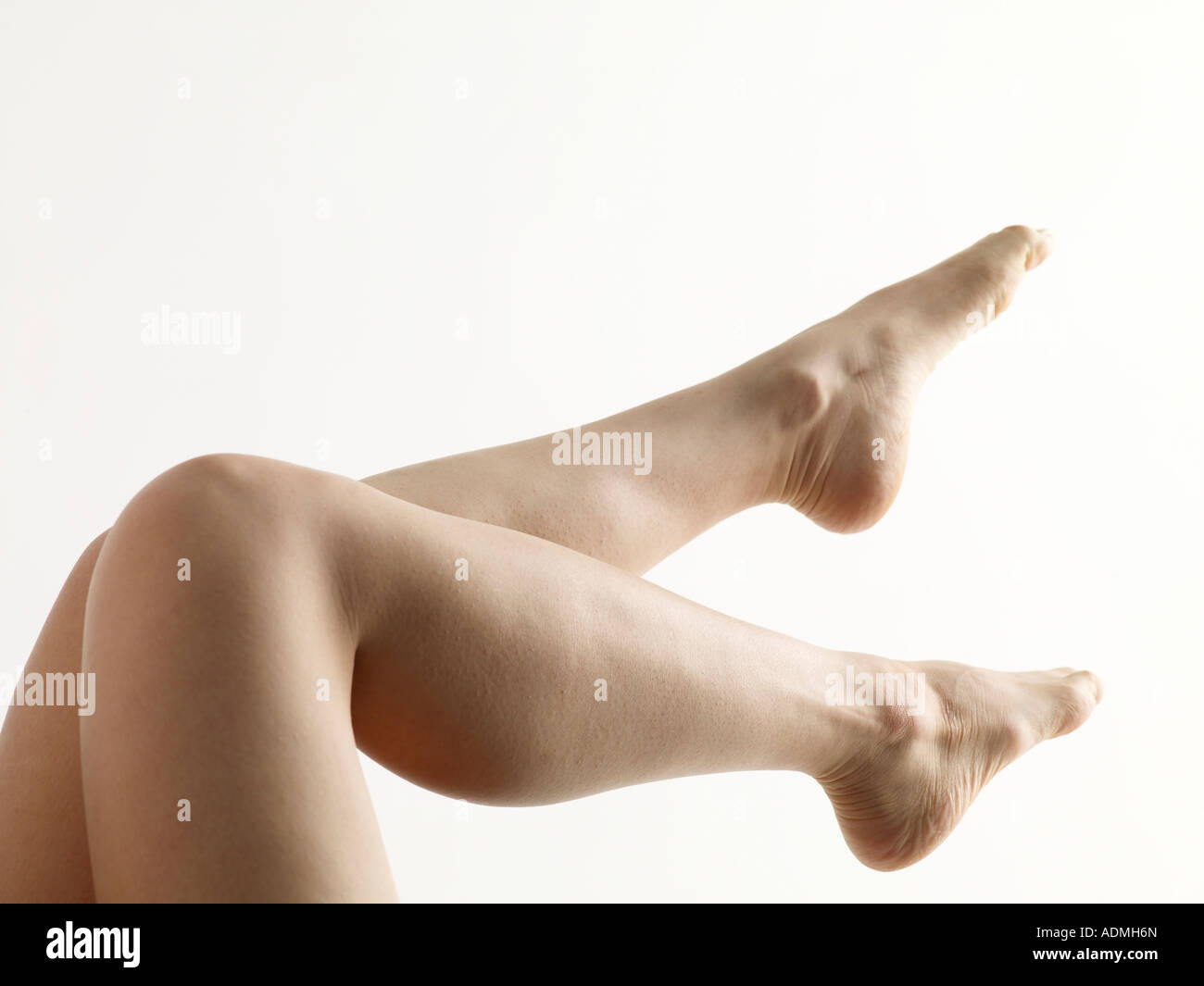 A pair of woman s legs up in the air Stock Photo