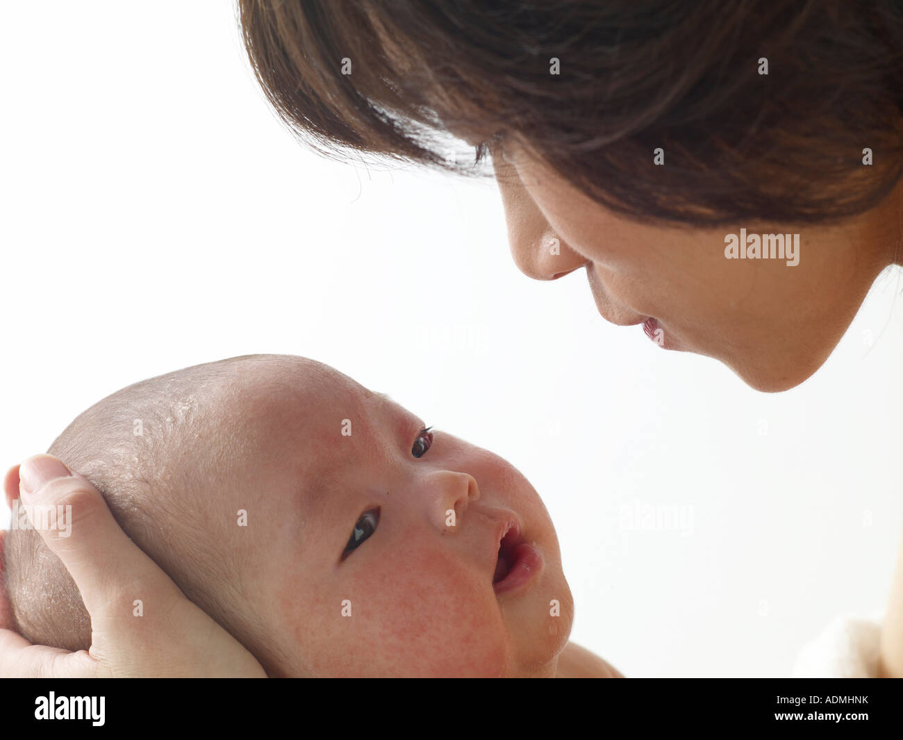 Woman lovingly holding baby hi-res stock photography and images - Alamy