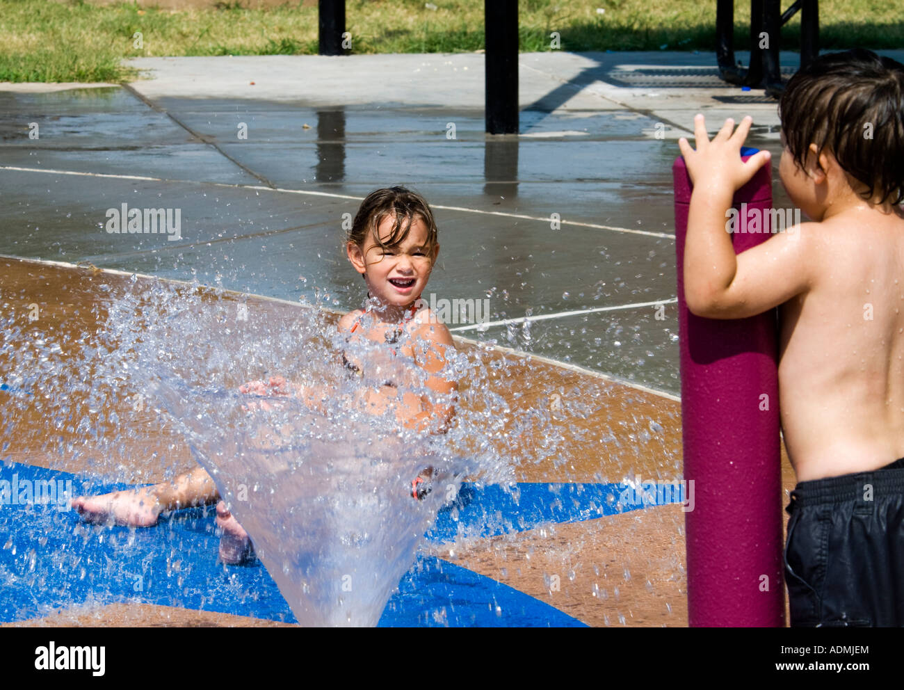 Young Girl and Boy Playing at a spray park in Oklahoma City, Oklahoma ...