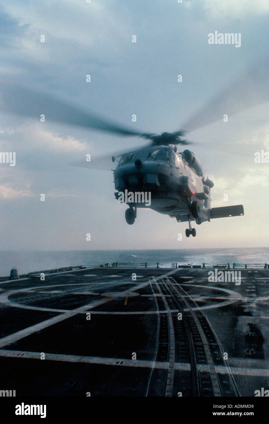 Low angle view of a SH-60B Sea Hawk helicopter landing on the deck of the USS Nicholas aircraft carrier Stock Photo