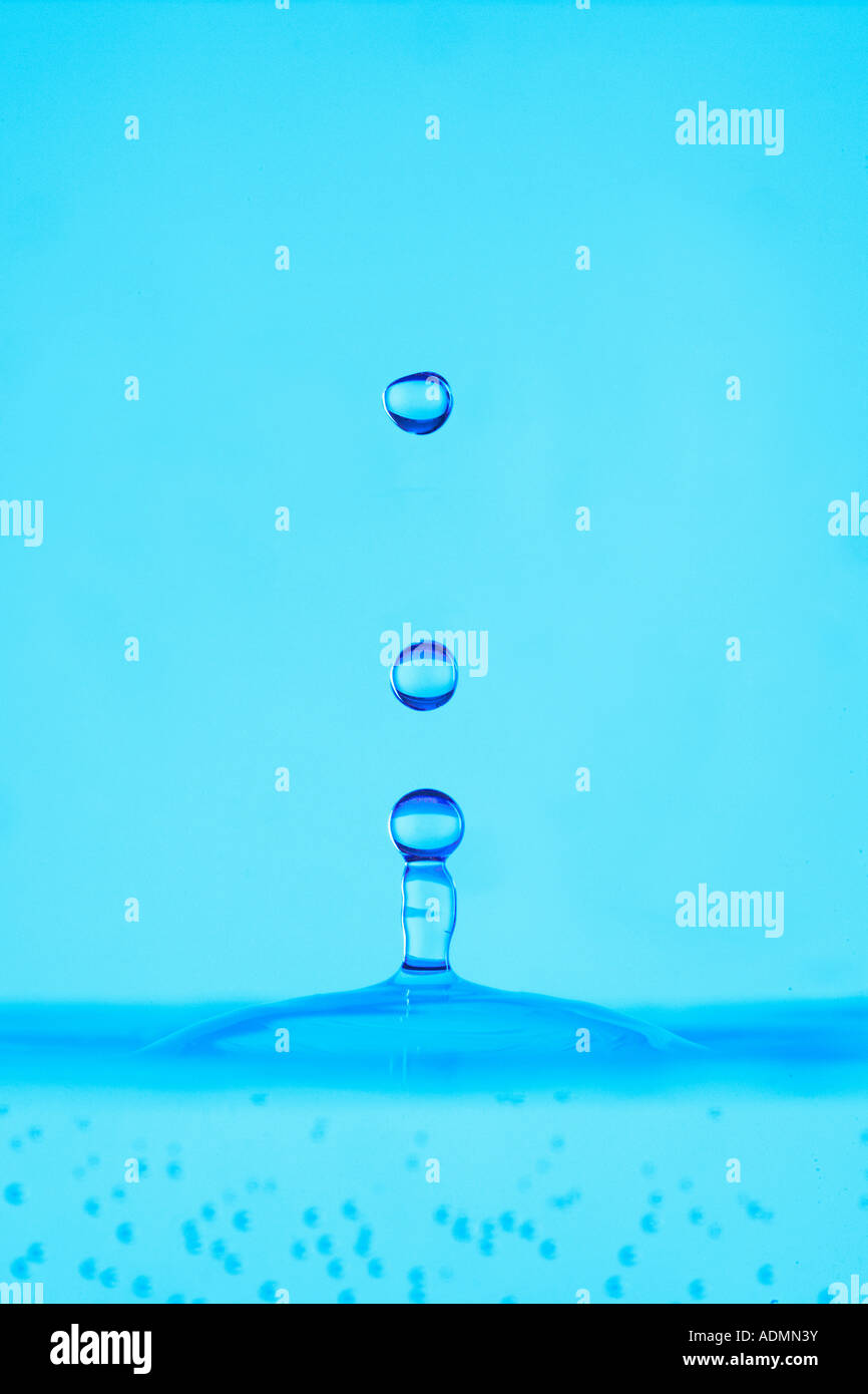WATER DROPLET SPLASHING INTO WATER Stock Photo - Alamy