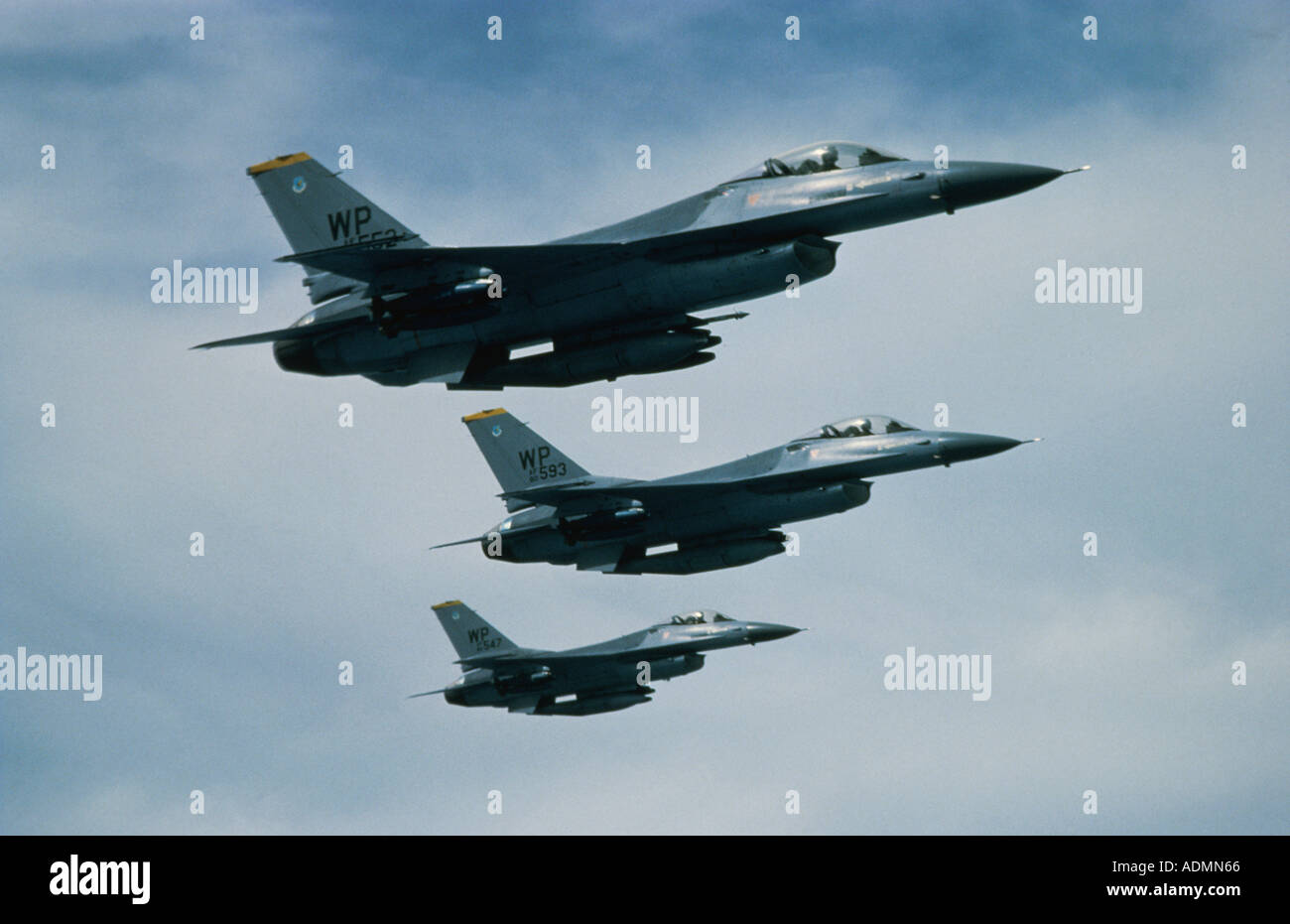 Low angle view of three F-16 Fighting Falcons flying in formation Stock Photo
