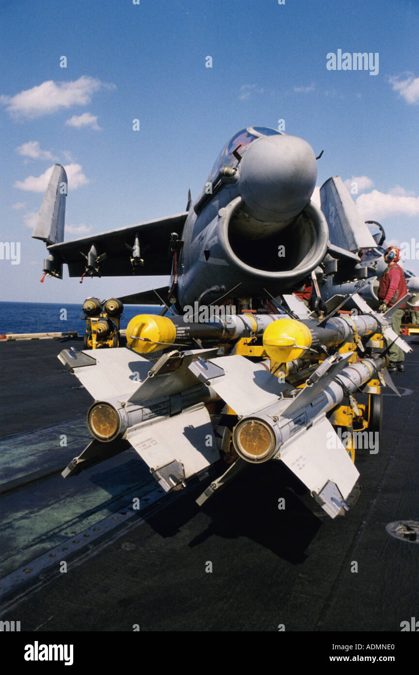 Arming of an A-7E Corsair II with AIM-9 Sidewinder Missiles and Mark 82 Bombs Stock Photo