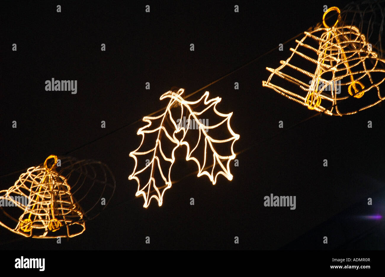 Close Up of  Festive Christmas Lights, Bells and Holly, Hanging in George Square, Glasgow. Scotland.06 Stock Photo