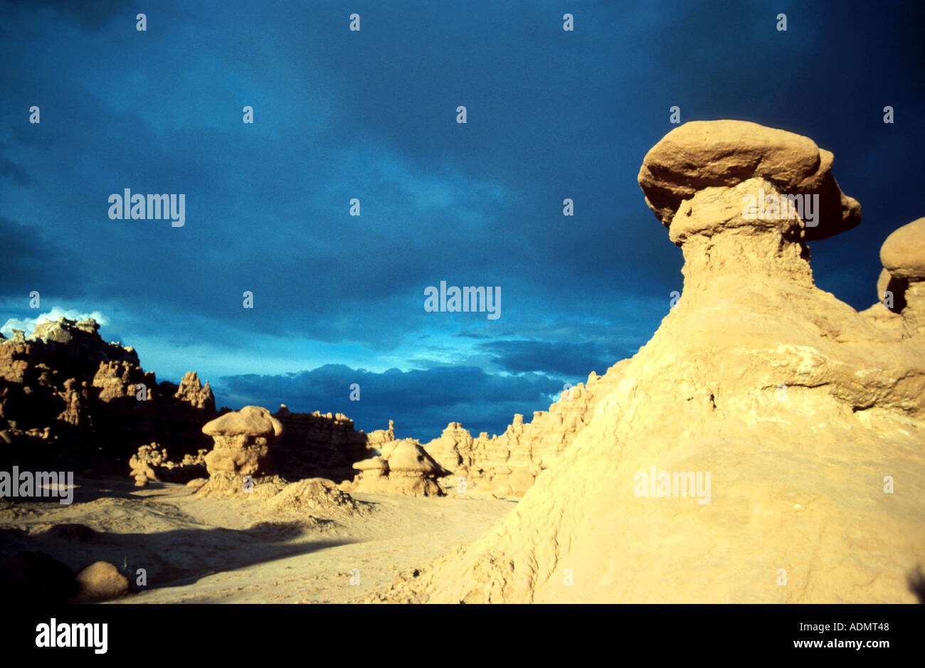 Hoodoo, eroded pillar protected at the top by a more highly resistant boulderUSA, Utah, Goblin Valley, Jun 99. Stock Photo
