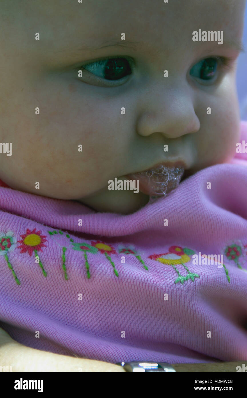baby with bubbles in mouth Stock Photo Alamy