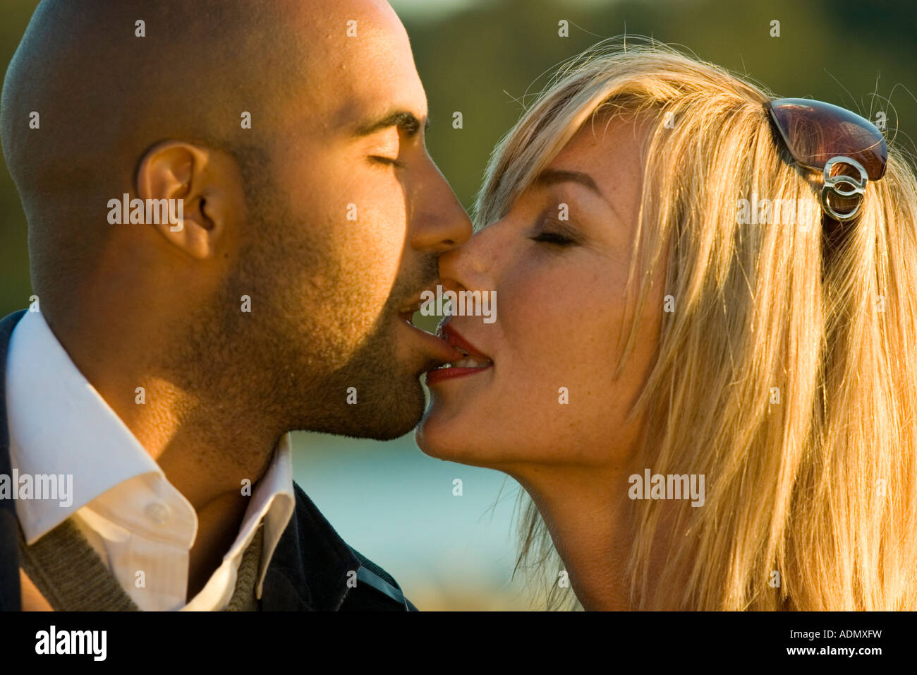 Close Up Head and Shoulders Interracial love story of a black man and a white woman Stock Photo