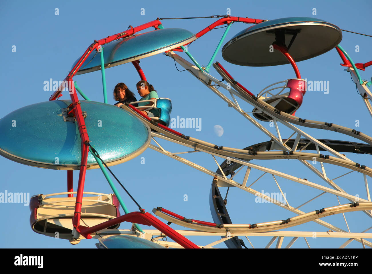 Paratrooper Carnival Ride Greene County Ohio Fair Moon is visible near