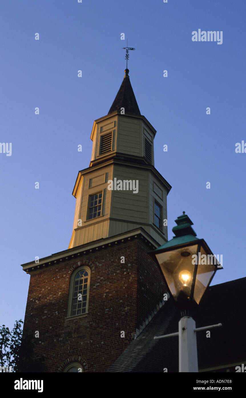 Lamp post in front of Bruton Parish Church in colonial Williamsburg Virginia at dusk  Stock Photo