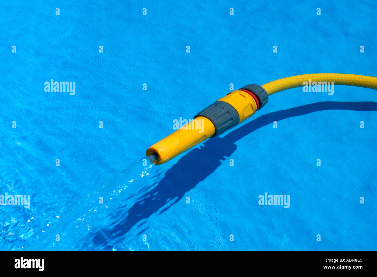 a hose pipe in full flow Stock Photo