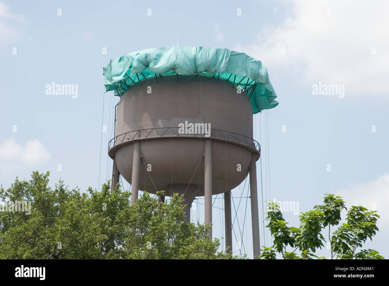 Municipal water storage tank undergoing maintenance sandblasting and