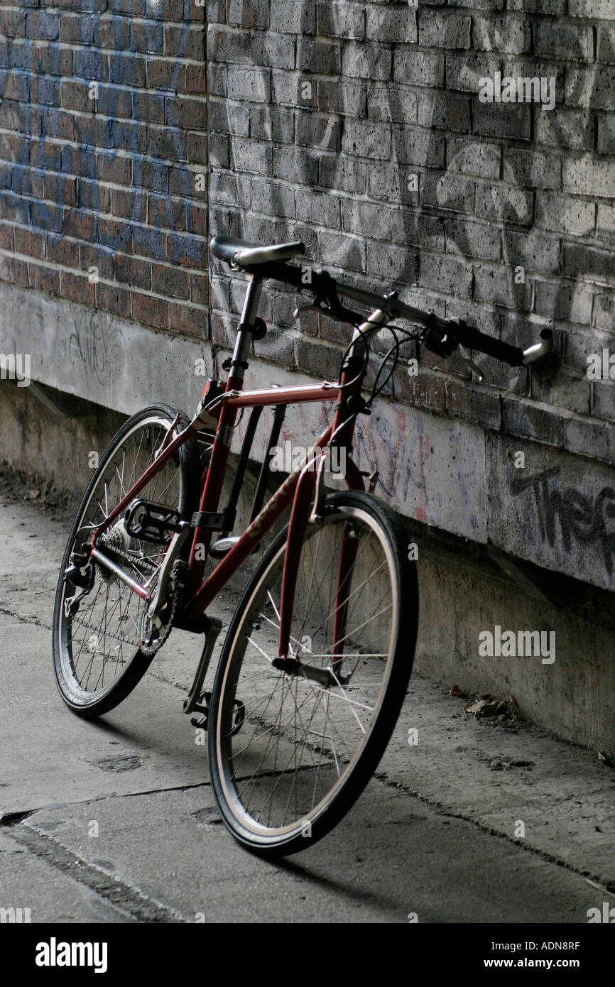 Mountain bike, leaning against a wall Stock Photo